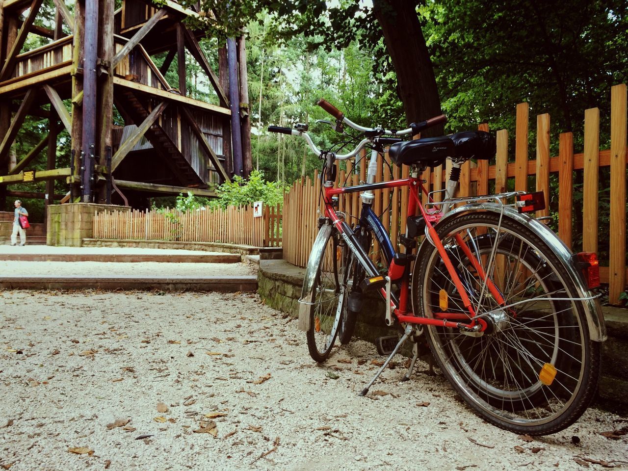 transportation, mode of transport, bicycle, land vehicle, stationary, wheel, parking, built structure, parked, architecture, travel, metal, abandoned, tree, day, outdoors, building exterior, leaning, street, no people