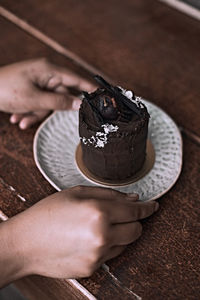 Midsection of woman holding ice cream