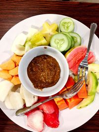 Close-up of fruits in plate on table