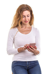 Young woman using mobile phone against white background