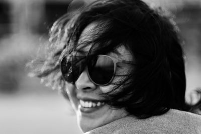 A young woman smiling happily during shopping.