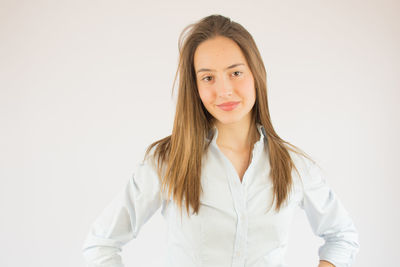 Portrait of a beautiful young woman over white background