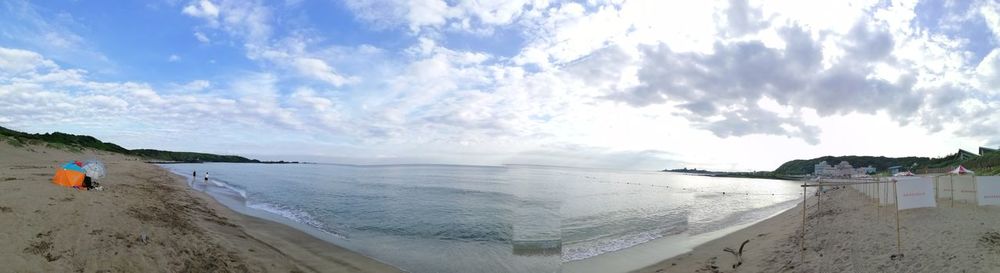 Panoramic view of beach against sky
