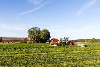 Tractor mowing grass