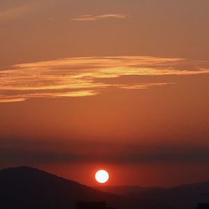 Scenic view of silhouette landscape against romantic sky at sunset