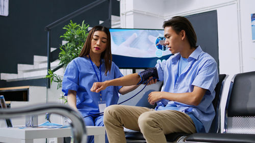 Female doctor examining patient in hospital