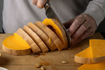 Midsection of man preparing food