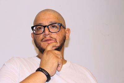 Portrait of mid adult man against white background