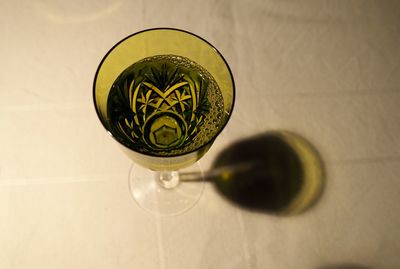 High angle view of wine in glass on table