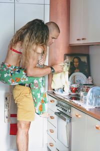 Midsection of woman standing at home