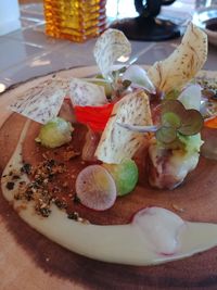 High angle view of fruits in plate on table