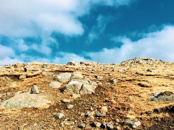 Low angle view of rock formations against sky