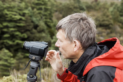 Portrait of man photographing