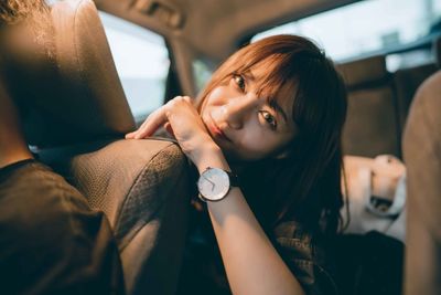 Portrait of woman sitting in bus