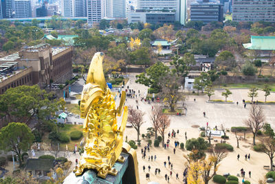 Panoramic view of statue and buildings in city