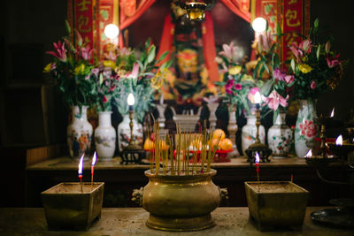 Lit candles in temple