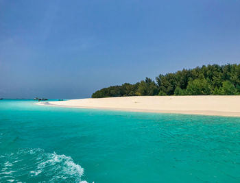 Scenic view of sea against clear blue sky