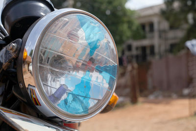 Close-up of reflection of car on glass