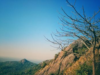 Scenic view of mountains against clear blue sky