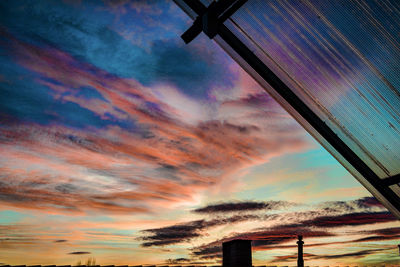 Low angle view of dramatic sky during sunset