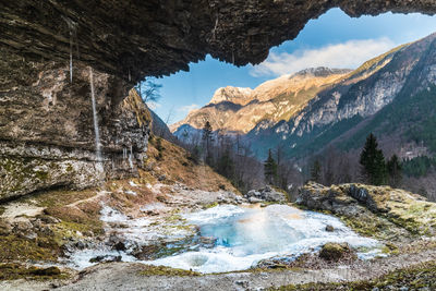 Winter. ice games in the fontanon of goriuda waterfall. friuli, italy.