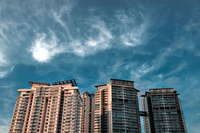 Low angle view of apartment buildings against sky