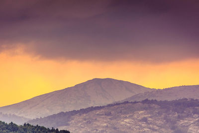 Scenic view of mountains against sky during sunset