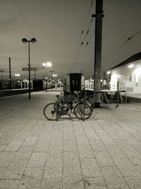 Bicycles parked in city against sky