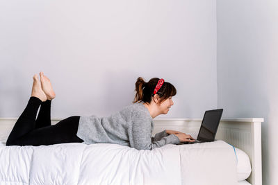 Midsection of woman using mobile phone