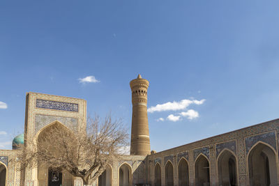 Low angle view of historical building against blue sky