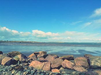 Scenic view of sea against blue sky