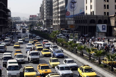 High angle view of traffic on road amidst buildings in city