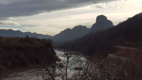 Scenic view of mountains against sky during sunset