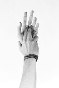 Close-up of human hand against white background