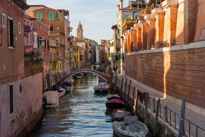 Canal passing through city buildings