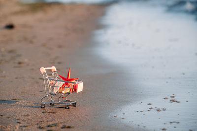 High angle view of shopping cart on beach