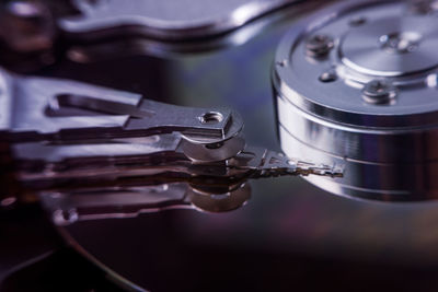 Close-up of hard drive on against black background