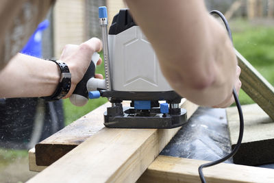 Close-up of hands working on table