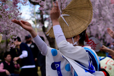 Side view of woman in traditional clothing dancing at park