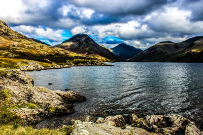 Scenic view of lake and mountains against sky