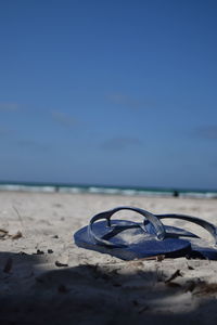 Surface level of sand on beach against sky