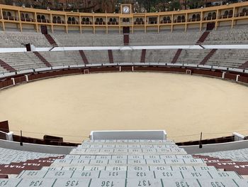 High angle view of empty benches in winter