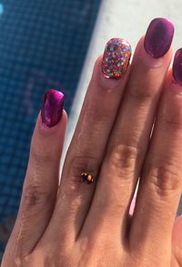 Close-up of woman hand with pink petals