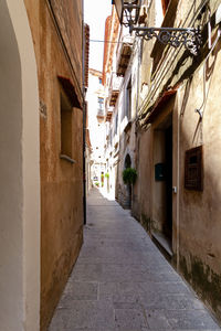 Narrow alley along buildings