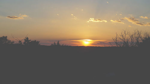 Scenic view of silhouette landscape against sky during sunset