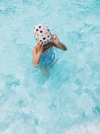 High angle view of boy in swimming pool