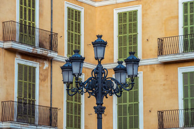 Low angle view of statue against building