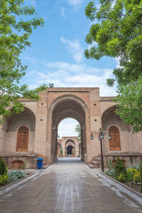 Archway of historic building against sky