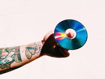 Close up of hand holding white wall