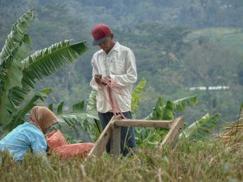 Full length of farmers in farm